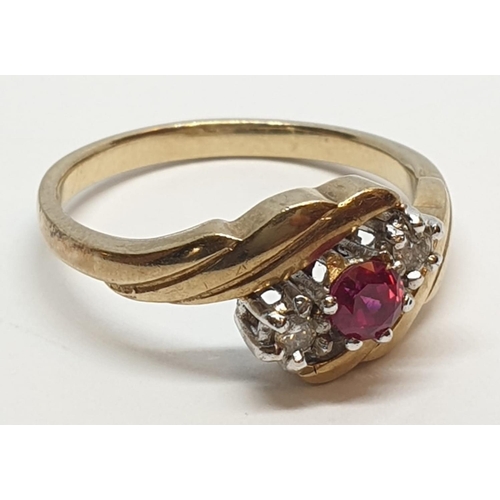 82 - 9ct Yellow gold three stone diamond and ruby ring. Weight 3g, Size N.