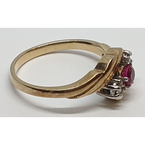 82 - 9ct Yellow gold three stone diamond and ruby ring. Weight 3g, Size N.