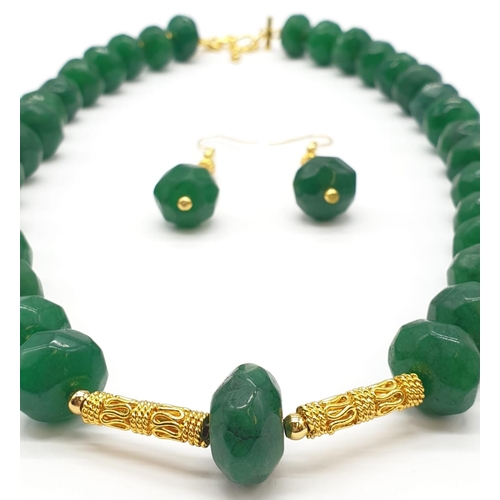 150 - A multifaceted, large beaded, opaque emerald necklace and earrings set in a presentation box. Neckla... 