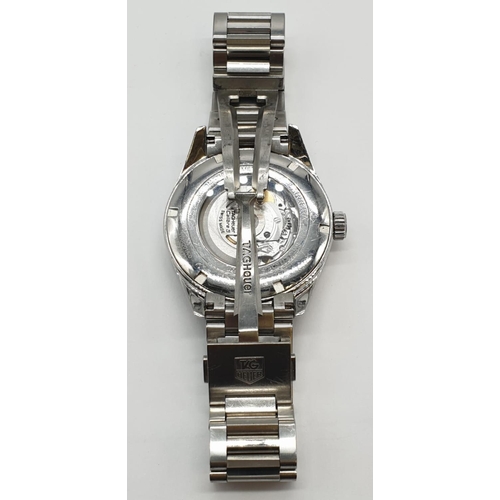 174 - Carrera Tag Heuer Calibre 5 automatic gents watch with black face and white metal strap and skeleton... 