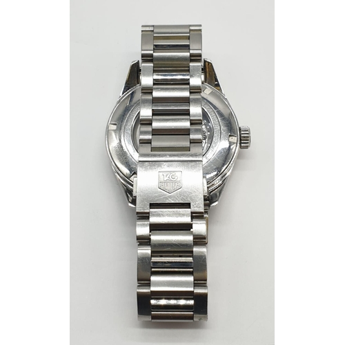 174 - Carrera Tag Heuer Calibre 5 automatic gents watch with black face and white metal strap and skeleton... 