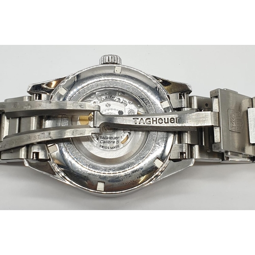 174 - Carrera Tag Heuer Calibre 5 automatic gents watch with black face and white metal strap and skeleton... 