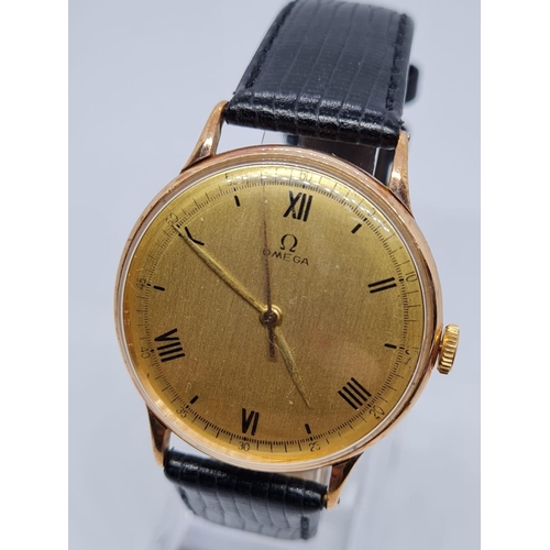 74 - Rose Gold vintage Omega gents watch with black leather strap. 32mm case.