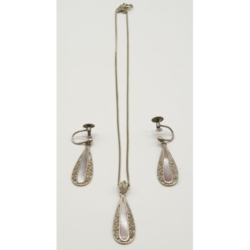 895 - Silver jewellery set to include pendant on chain and matching pair of earrings. 
Mother of pearl des... 