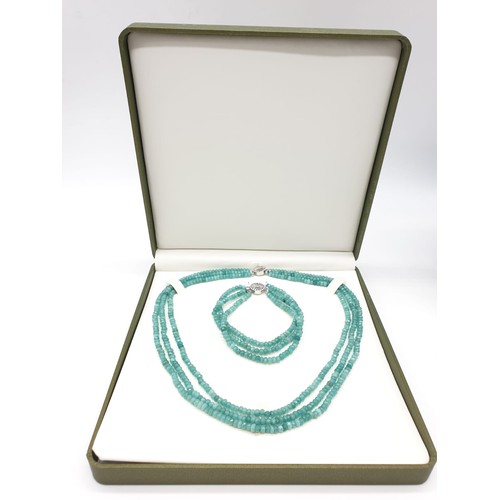 80 - A three row of faceted Colombian Emeralds necklace and bracelet set in a presentation box. Necklace ... 