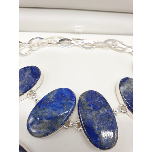 130 - A lapis lazuli necklace and bracelet set is a presentation box. Necklace length: 50-54cm, bracelet l... 