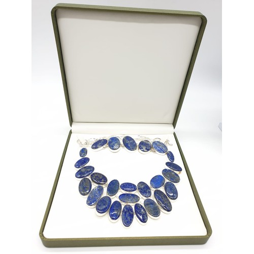 130 - A lapis lazuli necklace and bracelet set is a presentation box. Necklace length: 50-54cm, bracelet l... 