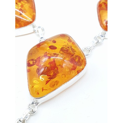 70 - An Art Deco amber style necklace and bracelet set in a presentation box. Necklace length: 52cm. brac... 