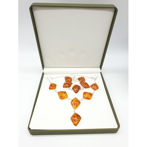 70 - An Art Deco amber style necklace and bracelet set in a presentation box. Necklace length: 52cm. brac... 