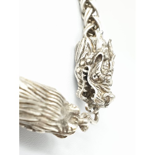 60 - A Tibetan silver, braded chain, necklace with two Chinese dragon heads. Necklace length: 68cm, weigh... 