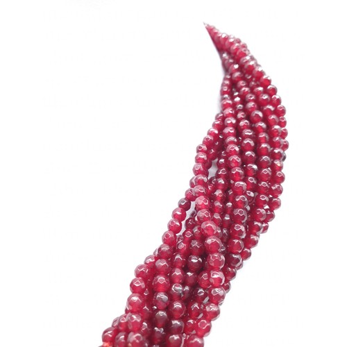 30 - A 15 row statement necklace with faceted rubies and a large Cartier Panther style clasp. Rubies are ... 