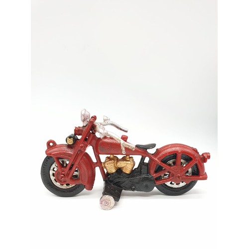 20 - A collector’s item, French, cast iron, MITCHELIN MAN, on a motorbike. Wheels turning with special so... 