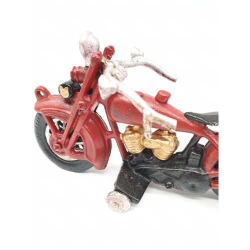 20 - A collector’s item, French, cast iron, MITCHELIN MAN, on a motorbike. Wheels turning with special so... 