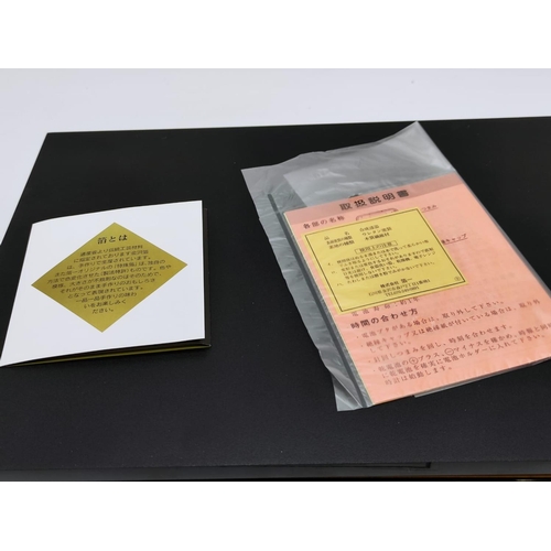 103 - A Japanese Hakuichi Gold-Leaf Folding Clock. unused, New in Box.