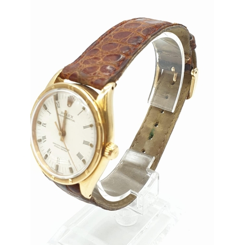 45 - Vintage 18ct Rolex oyster perpetual gents watch with gold case and leather strap, automatic and 36mm... 