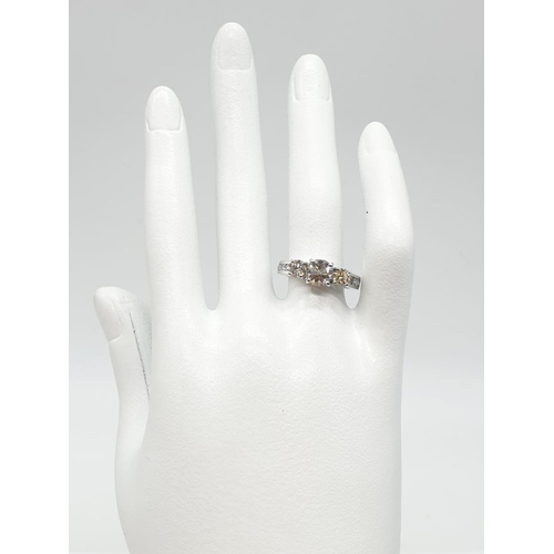 58 - 18ct white gold ring with 1.16ct diamond centre (colour K, clarity VS1) and 2 diamonds on the sides ... 