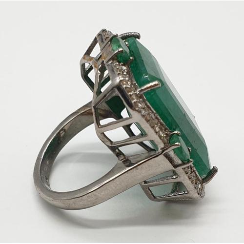 128 - Emerald M size silver ring with 23.50ct emerald and 0.8ct rose cut diamonds