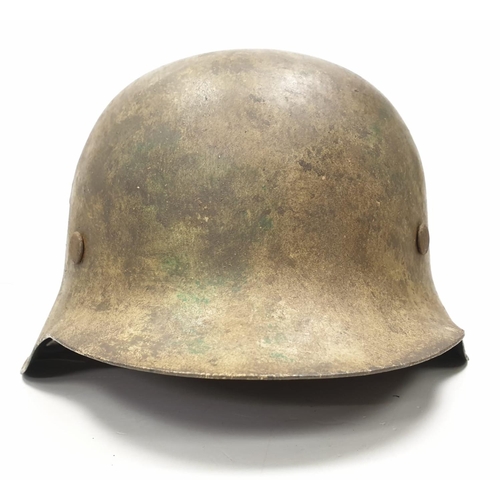 11 - WW2 German M42 Normandy Helmet. This helmet is a typical post 1943 variant in slate grey workshop pa... 