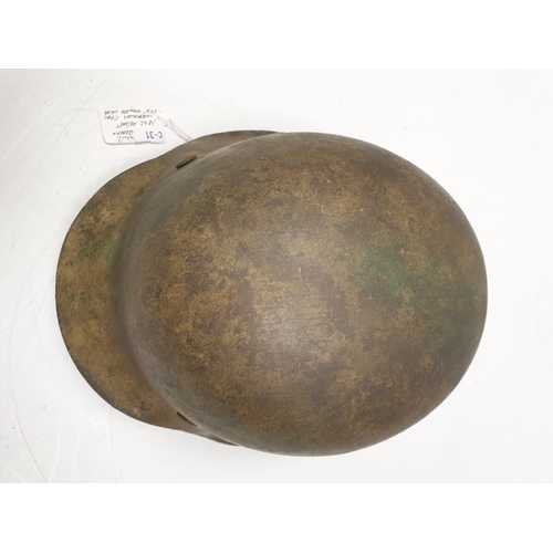 11 - WW2 German M42 Normandy Helmet. This helmet is a typical post 1943 variant in slate grey workshop pa... 