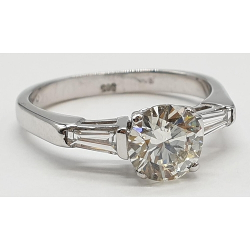 27 - 14ct white gold ring with 1.02ct diamond centre (colour J, clarity VS1) and 2 baguette cut diamonds ... 