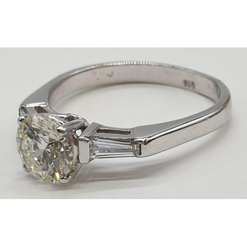 27 - 14ct white gold ring with 1.02ct diamond centre (colour J, clarity VS1) and 2 baguette cut diamonds ... 