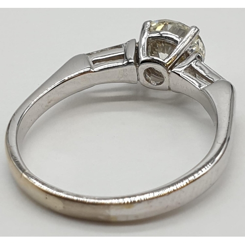 27 - 14ct white gold ring with 1.02ct diamond centre (colour J, clarity VS1) and 2 baguette cut diamonds ... 