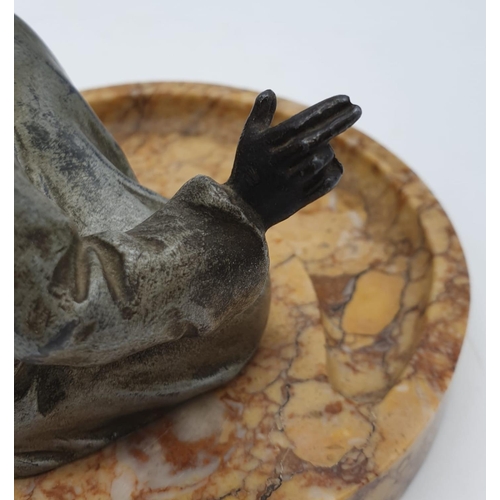 44 - Ashtray of a Moroccan preacher man figurine on a marble base. Height 11cm.