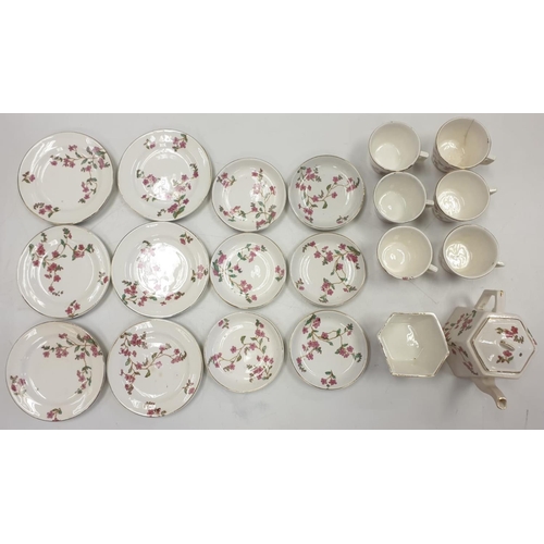 89 - Vintage Children's China Tea Set featuring 6 cups, 6 saucers, 6 plates, sugar bowl and teapot. Prett... 