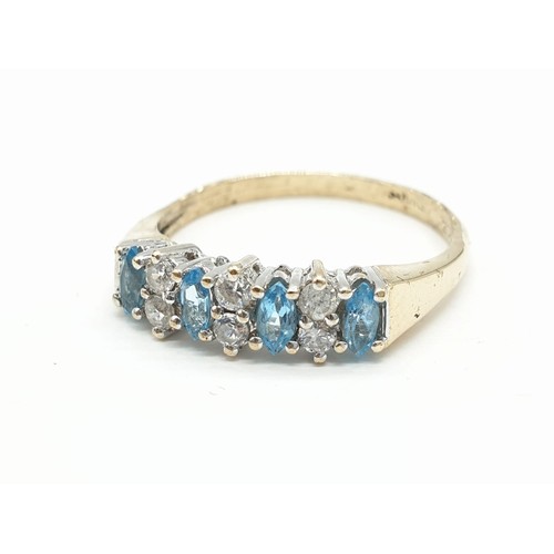 136 - 9ct Gold ring having aquamarine and clear stones set to top in half hoop style. Size O. 2.4 grams ap... 