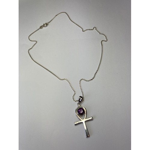 805 - Silver Celtic cross  set with large circular amethyst mounted on silver chain. Silver chain 45 cm ap... 