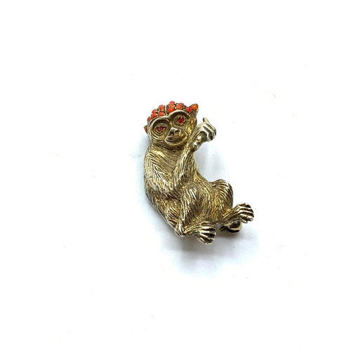 601 - Silver gilded monkey eating a banana brooch with corals , 12.2g weight and 2.5cm long approx