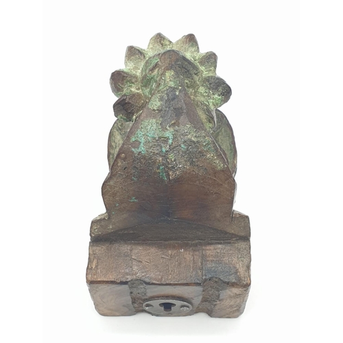 165 - An antique wooden Indian temple wall candle holder - late 19th century. 12cm High.