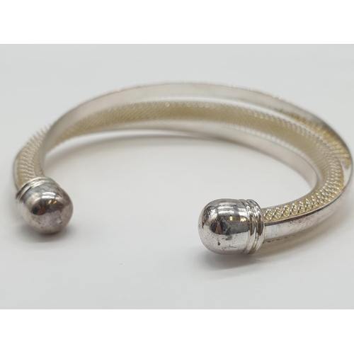 171 - Two 'Tiffany style' twisted German, silver outer layer bracelets. 7cm in diameter.