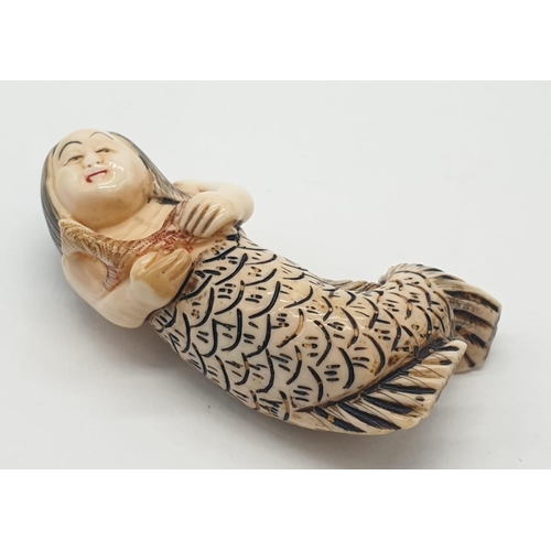 173 - A miniature Chinese ivory mermaid - circa 1890s - 5cm long.