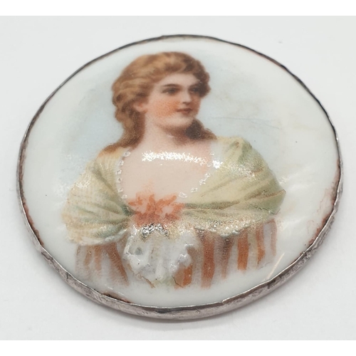 180 - A vintage miniature porcelain portrait with London silver 1905 base.