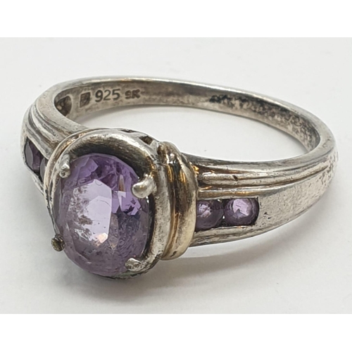 349 - Silver ring with amethyst centre stone, 4.6g and size R