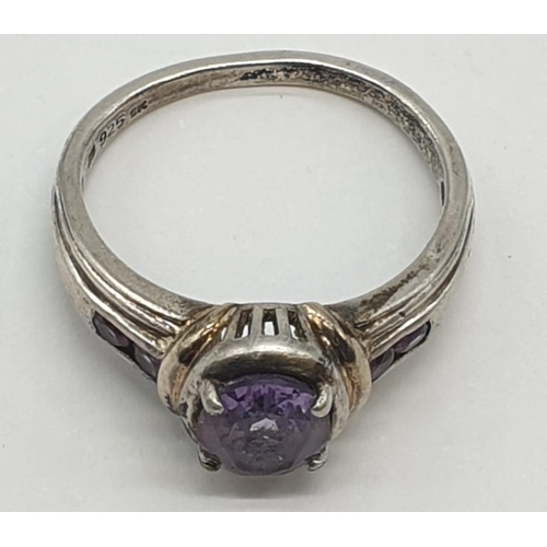 349 - Silver ring with amethyst centre stone, 4.6g and size R