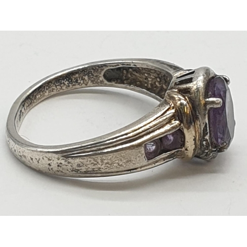 349 - Silver ring with amethyst centre stone, 4.6g and size R