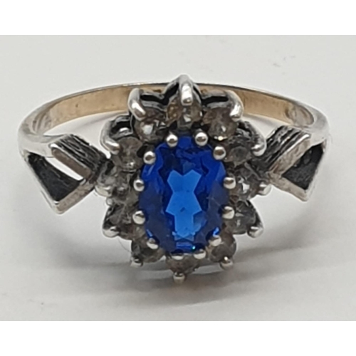 358 - 9ct gold and silver ring with blue stone, weight 2.1g and size L