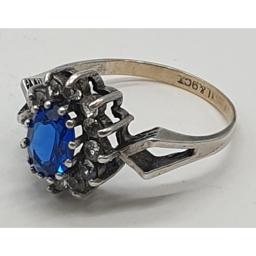 358 - 9ct gold and silver ring with blue stone, weight 2.1g and size L