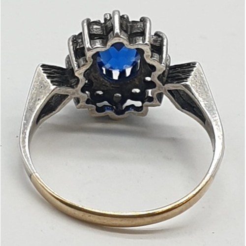 358 - 9ct gold and silver ring with blue stone, weight 2.1g and size L