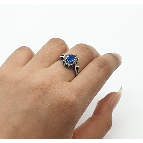 358 - 9ct gold and silver ring with blue stone, weight 2.1g and size L