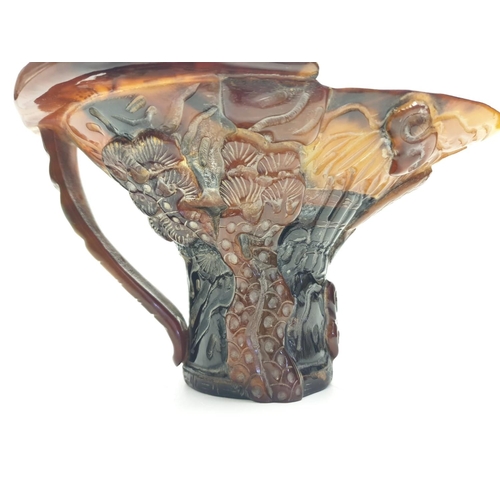 163 - A faux Rhino horn libation cup.