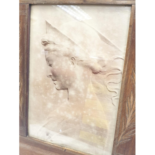 192 - A Santa Cecilia profile image in a wood frame. 26cm x 38cm.