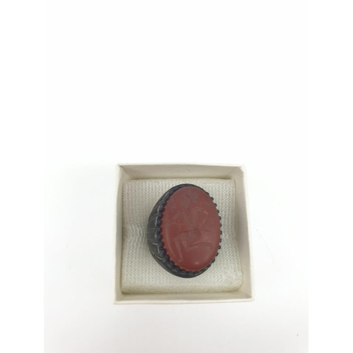 23 - A Roman-Thracian silver ring with a carved carnelian seal depicting a soldier with a spear. The ring... 