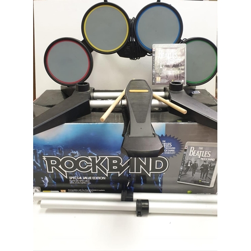 235 - PS2 Rock Band drum kit and disc game