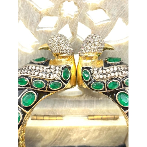 36 - A glamorous, Indian, Bollywood style bracelet together with a pair of earrings presented in a hand c... 