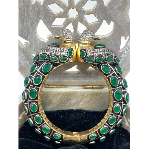 36 - A glamorous, Indian, Bollywood style bracelet together with a pair of earrings presented in a hand c... 