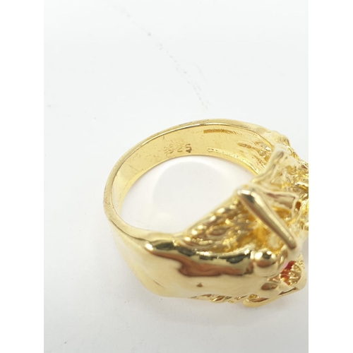 38 - An unusual silver (stamped 925) and gold filled ring depicting a lady offering her heart. Ring size:... 