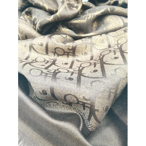 5 - A high quality, large, Cashmere and silk shawl, with the inscription CHRISTIAN DIOR and DIOR woven i... 